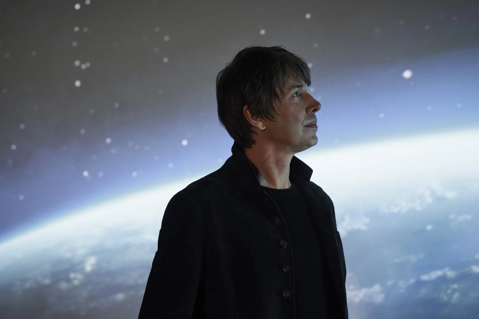 Brian Cox, the physicist and science broadcaster, before an image of the Earth from space